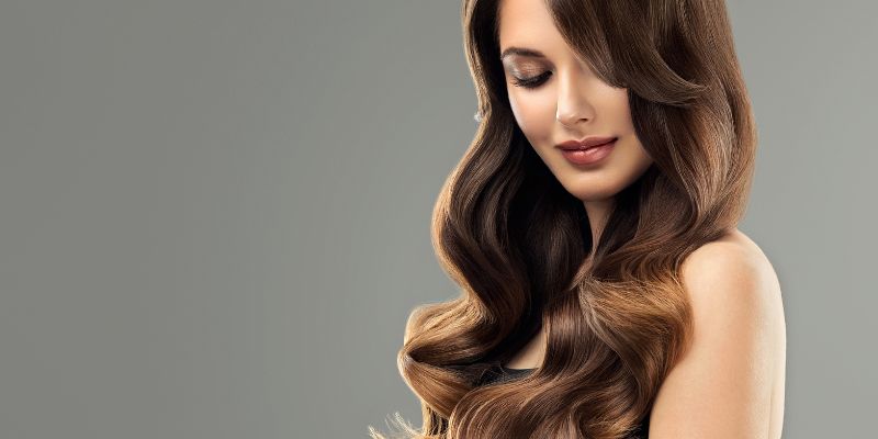 Create soft, voluminous waves using a curling iron or hot rollers, then brush them out gently for a glamorous finish. This timeless hairstyle is perfect for special occasions or when you want to add a touch of vintage charm to your everyday look.