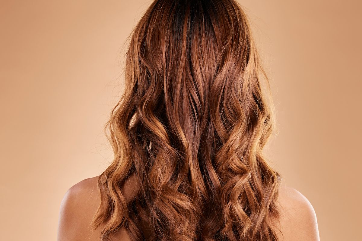 The woman has trendy partial highlights on brown hair that look phenomenal.