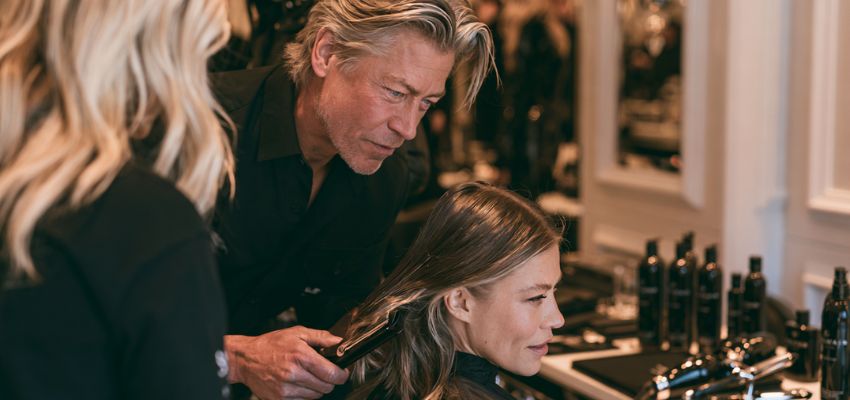 Experienced hairstylist working on a client’s hair while exploring how much do hair stylists make