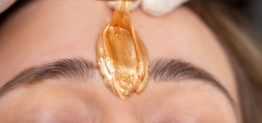 The woman tried using sugar wax on her face.