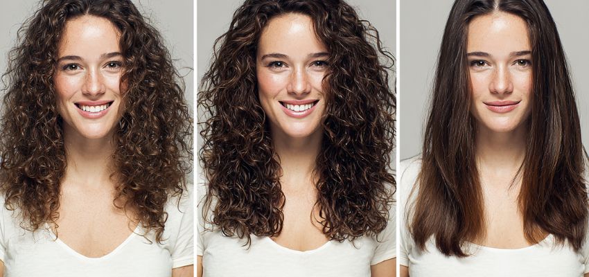 The woman tries different hairstyles.