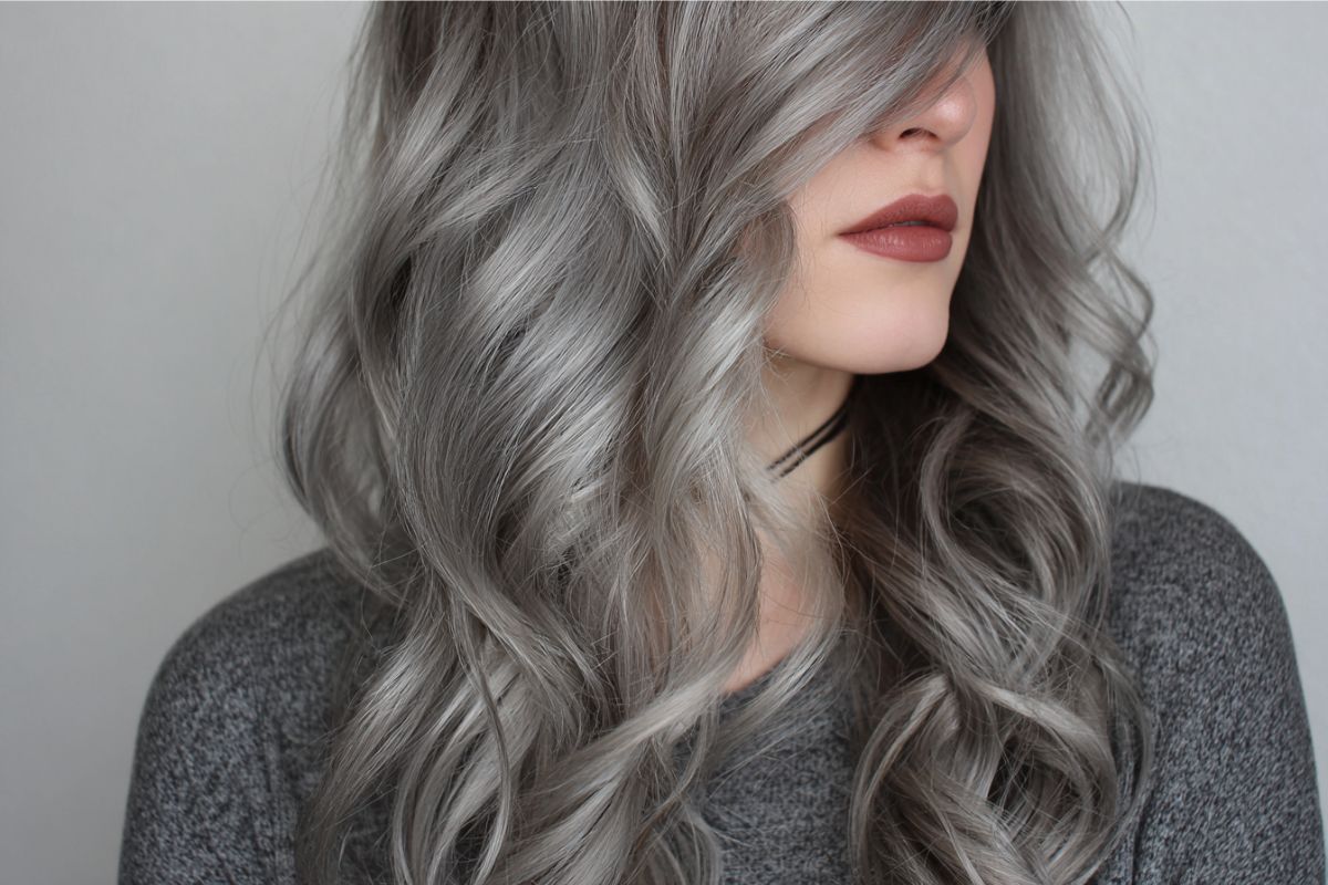 Long ash color hairstyle with soft waves for a modern look